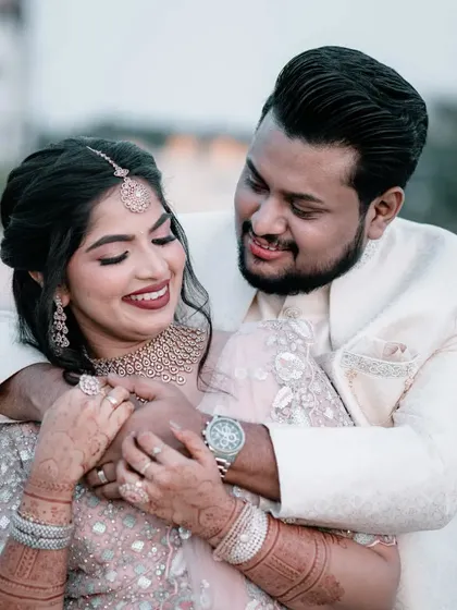 The pure joy of starting a new life together. This is a candid shot from an engagement party, where we focused on the couple's happy expressions and easy chemistry. We aim to capture the genuine smiles and laughter of your celebration.