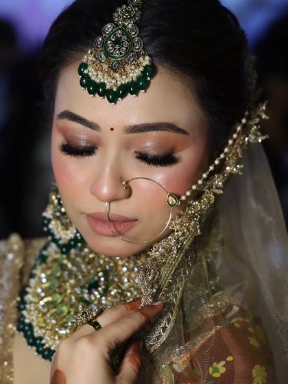 Another angle of the expo look, with the dupatta framing the face. This shows how the complete look comes together with the outfit and jewelry.
