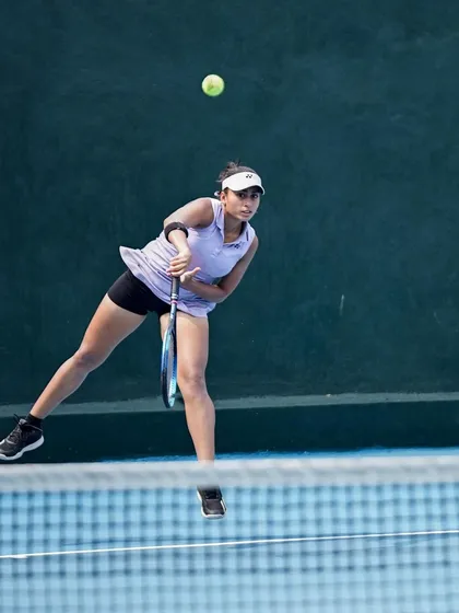 A glimpse into the dedication it takes to build a powerful serve. Here, one of our high-performance players executes a jump serve during a training session on our covered hard courts, demonstrating the explosive technique we cultivate.