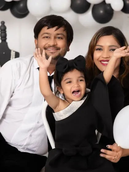 A candid moment of love and laughter during a family photoshoot. We encourage playful interactions to capture the authentic joy and personality of your family.