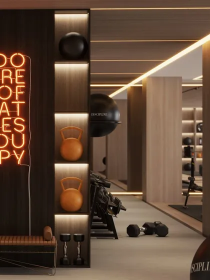 This render shows the clever use of vertical niches for storing kettlebells and other small equipment, combining storage with a strong design element.