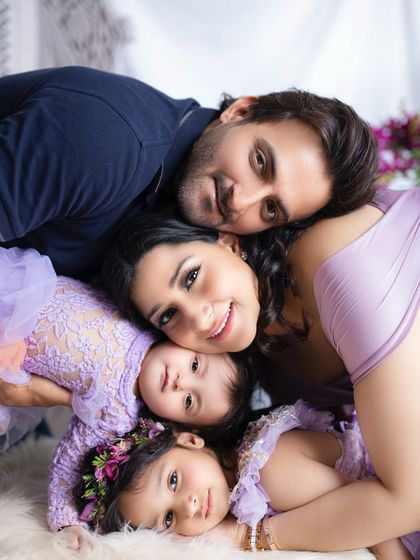 A fun and unique "family stack" pose. This is a great way to get a creative and memorable shot that shows how close your family is.