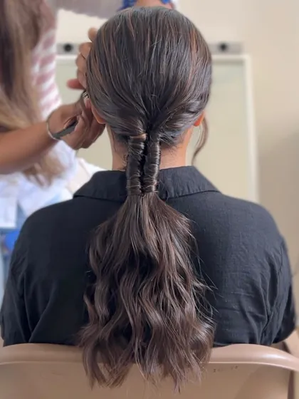 A modern fishtail pony, a chic and intricate style for any occasion.