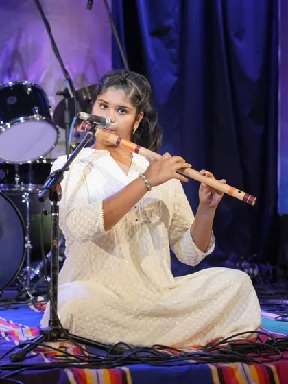 A focused shot of our student Mudita K Dave during her Raag Hamsadhwani flute performance.