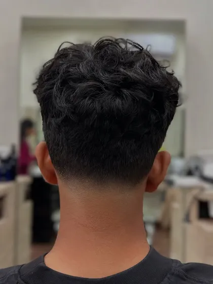 The back view of a taper fade, showcasing the seamless graduation from skin to hair. This level of precision is what we drill down on in our hands-on sessions.