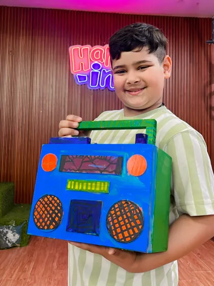 Another fantastic boombox creation, this one with a bright green handle and colorful details.