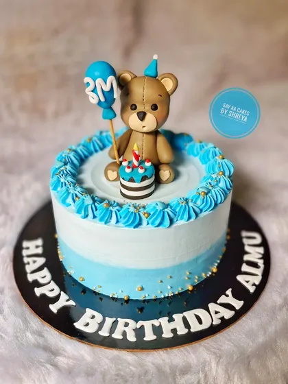 Celebrating three sweet months with this adorable teddy bear cake. The little bear is holding a balloon and a tiny cake of his own, marking this cute mini-milestone in style.
