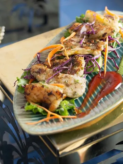 My grilled fish is a light and flavorful option for seafood lovers. The fish is marinated and grilled perfectly, served with a fresh garnish and lemon.