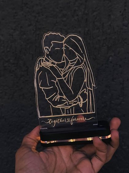 This wireless LED sketch is perfect for your desk or even your car dashboard. I turn your photo into line art on an acrylic plaque that lights up. It also has a built-in pen holder.