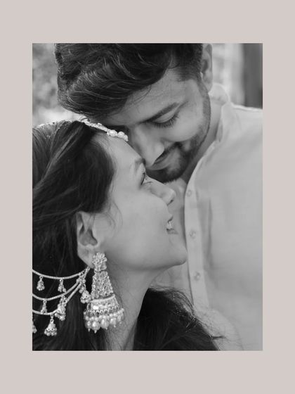 An intimate black and white portrait of a couple during their Haldi, capturing a quiet moment of connection.