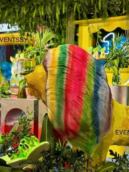 Even the king of the jungle gets a colorful twist, with a rainbow-maned lion as a central prop.