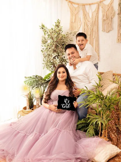 A fun and candid family moment during a maternity shoot. The older brother's playful energy brings so much life to the photograph.