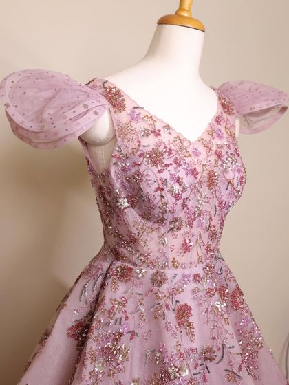 A close-up of the fairytale lilac gown's bodice. The intricate floral embroidery and sequin work are simply breathtaking.