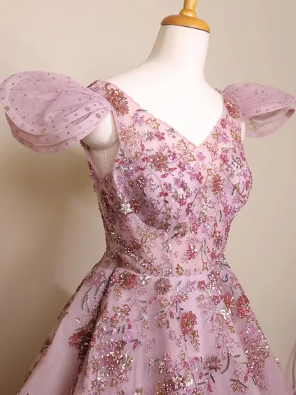 A close-up of the fairytale lilac gown's bodice. The intricate floral embroidery and sequin work are simply breathtaking.