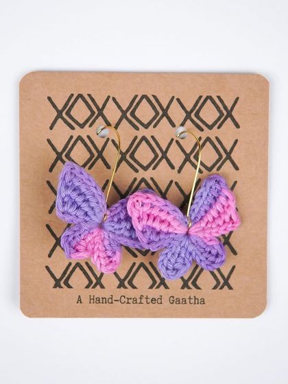 A product shot of the pink and purple 'Titli' earrings. This color combination is so vibrant and fun.