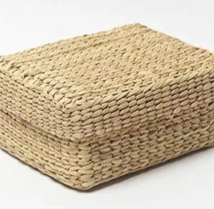 A rectangular, lidded storage box woven from natural fibers. This versatile box is perfect for organizing small items, storing keepsakes, or as an eco-friendly gift box.