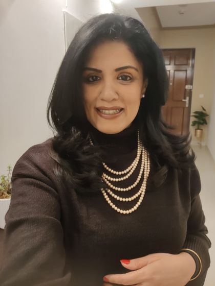 A long, multi-strand pearl necklace is a versatile accessory. I draped it over a simple black turtleneck to add a touch of classic glamour to my winter outfit.