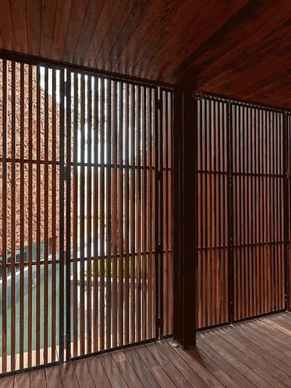 A detail of the sliding wooden screens from one of our villa projects. This image highlights our obsession with craftsmanship and materials, creating elements that are not only functional but also add texture, warmth, and a connection to nature.