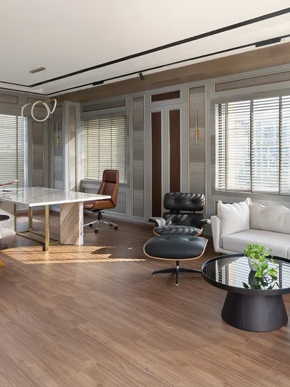 An executive cabin should be a statement of leadership and taste. In this space for EaseMyTrip's MD, I combined soft gray paneling with a commanding marble desk and iconic mid-century furniture. The result is a workspace that is both luxurious and highly functional, filled with natural light to create a calm, focused environment.