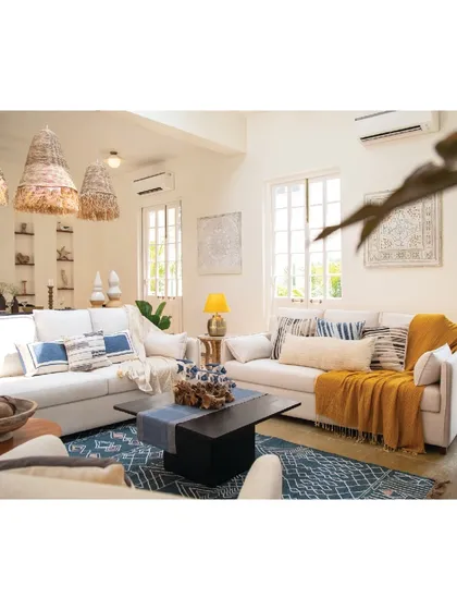 This holiday home in Goa was designed as a place to reconnect with nature. The living space is bright and sun-drenched, filled with natural materials like rattan and jute, and a cool color palette of blues and yellows. We used plush white sofas and handcrafted decor to create a home away from home, a perfect escape to find peace and solace.