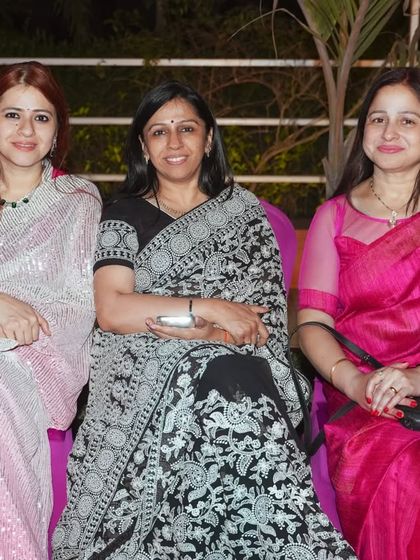 It's a party for the adults too. We capture candid photos of your guests enjoying themselves, like this shot of friends having a great time at the event.