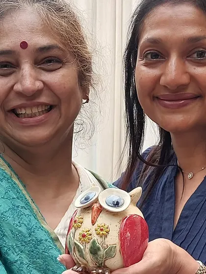 Two happy customers with one of my floral owl sculptures. Seeing my work bring smiles to people's faces is the best reward.