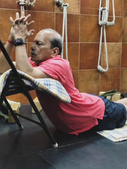 A restorative pose on a chair.