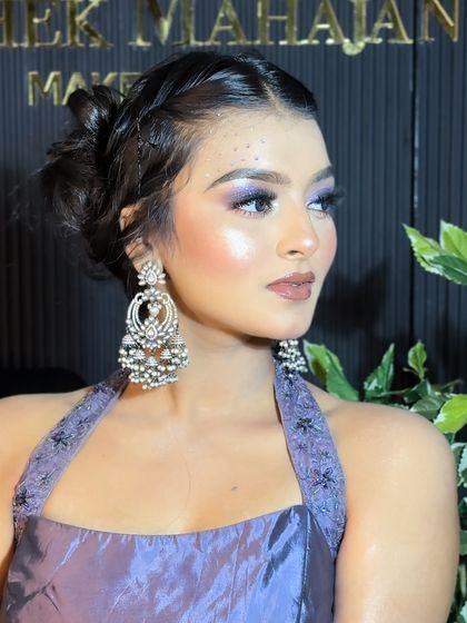 A side profile of the dreamy party look, showcasing the elegant updo and stunning earrings.