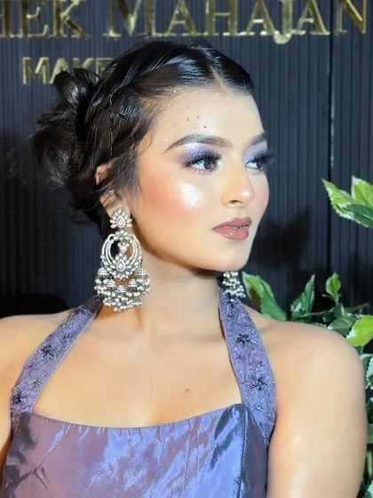 A side profile showcasing the elegant hairstyle and the shimmering eye makeup.