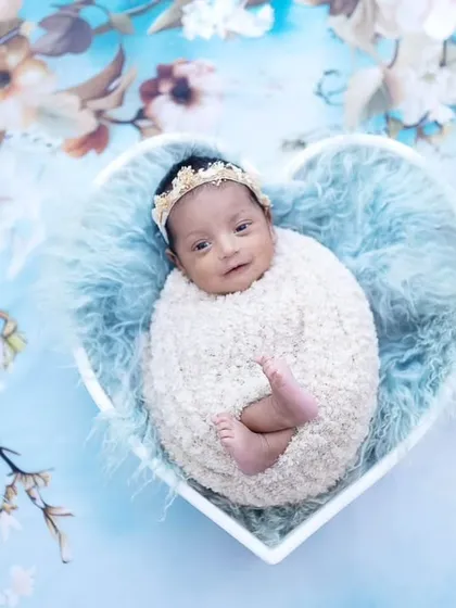 The same little angel, this time with a gentle smile. I conduct these newborn photoshoots at my studio or as home visits across Mumbai and Chembur.
