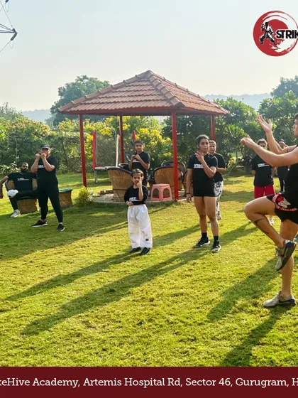An instructor leads an outdoor training session in a park. Taking our practice outside allows for different types of drills and adds an element of adventure to our training regimen.
