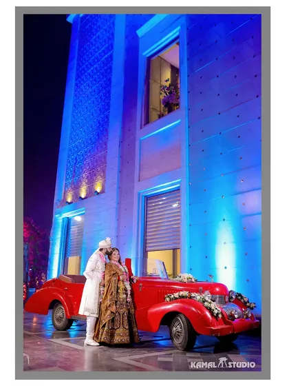 Adding a touch of vintage glamour with a classic car. Props like these help tell a story and add a unique, stylistic flair to your pre-wedding photos, making them stand out.