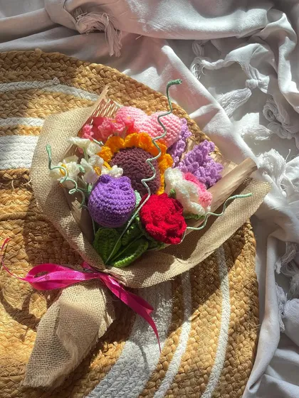 A beautiful shot of my "Lover's Bouquet" in the sunlight. This mixed arrangement includes a sunflower, rose, tulip, and other colorful blooms, all handmade and wrapped in rustic burlap.
