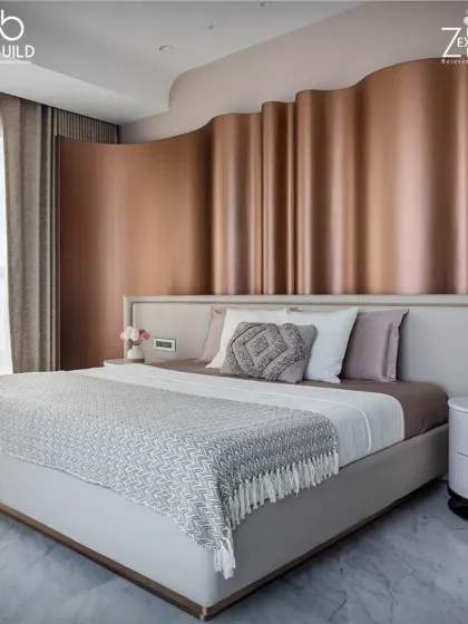 The bedroom in 'The House of Arcs' features a unique, wavy metallic headboard that adds a sense of fluidity and movement to the space.