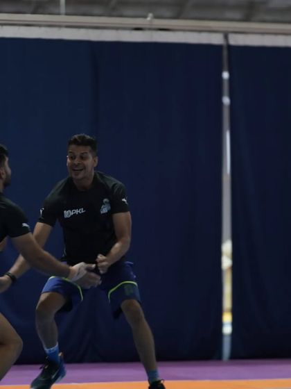 A playful moment of mock combat with the players. Team spirit is built on these interactions.