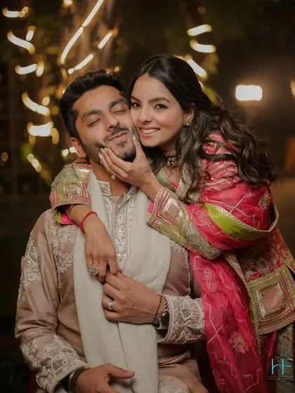 We believe the most beautiful moments are often the most genuine. This playful, candid shot captures the pure joy and affection between a couple. It's these unposed, happy memories that truly tell your story.