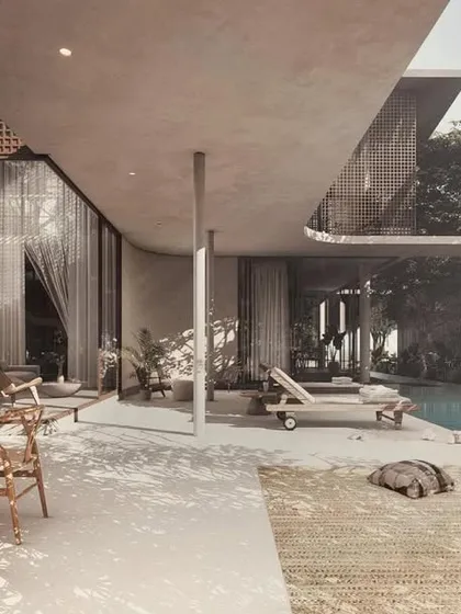 The House of Veils is a study in creating soft, secret spaces on a compact plot. The design progressively unveils itself, with flowing walls and large overhangs that open onto a serene pool deck, seamlessly blending the social spaces with tropical greens.