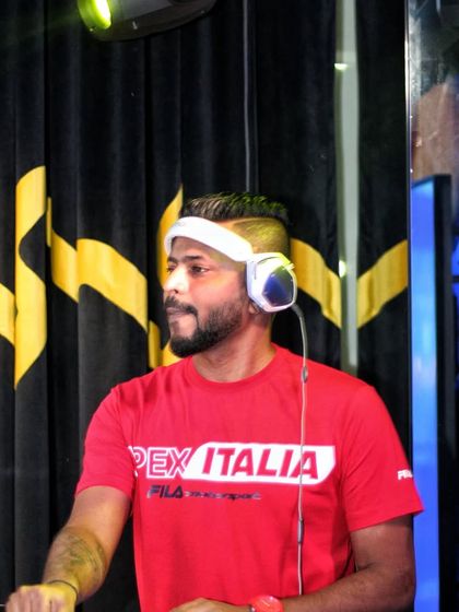 A portrait of me in my element, wearing my signature headphones and focused on the music.