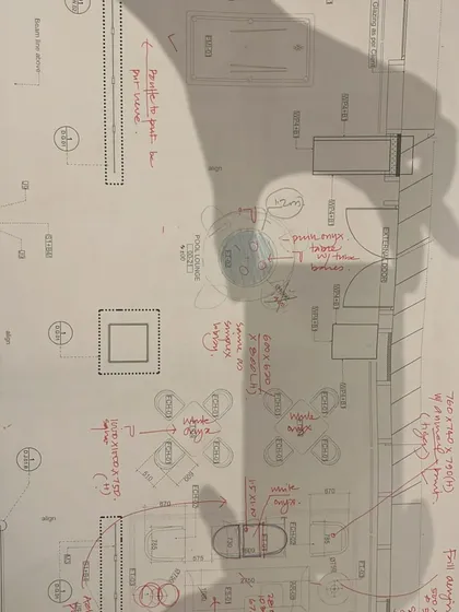 A close-up of a floor plan with hand-drawn annotations. This is where the dialogue between the design vision and the practical execution happens.