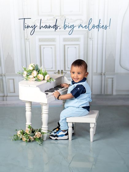 Tiny hands, big melodies! This little musician is completely absorbed in his piano playing, creating a beautiful and focused portrait.