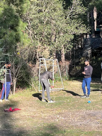 The process of laying out the grid for a new structure on site. This hands-on work is essential for translating the architectural plans from paper to the ground, ensuring the building is placed with sensitivity to its surroundings.