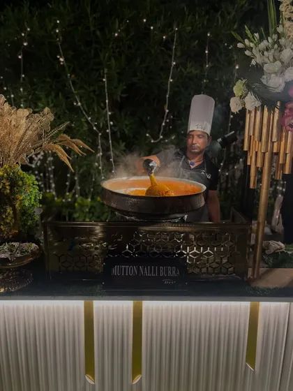 My chef serves a steaming portion of Mutton Nalli Barra, a popular live station dish that always draws a crowd with its incredible aroma and authentic taste.