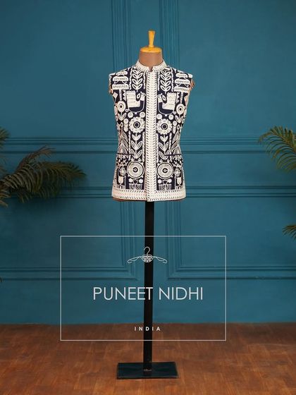My Warli art collection, featuring a sleeveless jacket with intricate folk art embroidery.