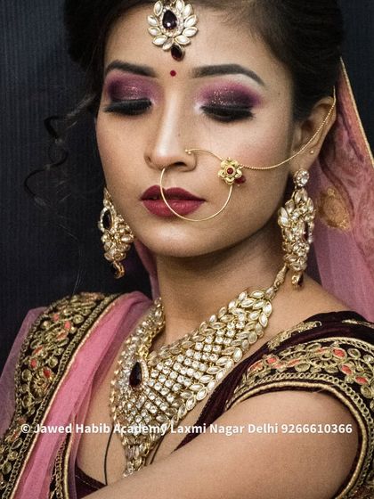 A student's work on a classic bridal look with deep plum and gold eyeshadow. This demonstrates the ability to create sophisticated and elegant makeup for any bride.