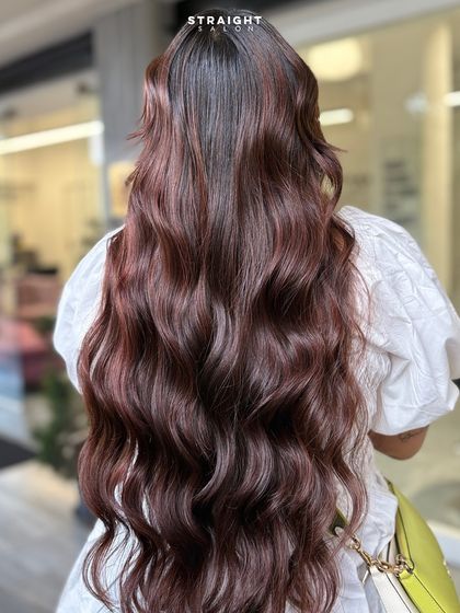 This long, luscious hair with beautiful subtle red tones is absolutely stunning. Perfect for adding depth and dimension.