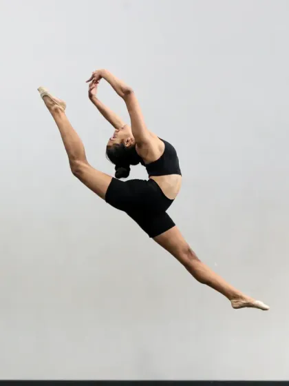 Grace, strength, and artistry in motion. This stunning leap from one of our gymnasts captures the essence of our program, where we focus on developing core strength, flexibility, and fluid technique.