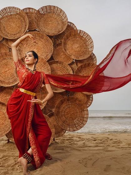 This outdoor photoshoot on the beach shows the versatility of the makeup. Even in bright, natural light, the look is polished and striking, proving it works beyond the stage.