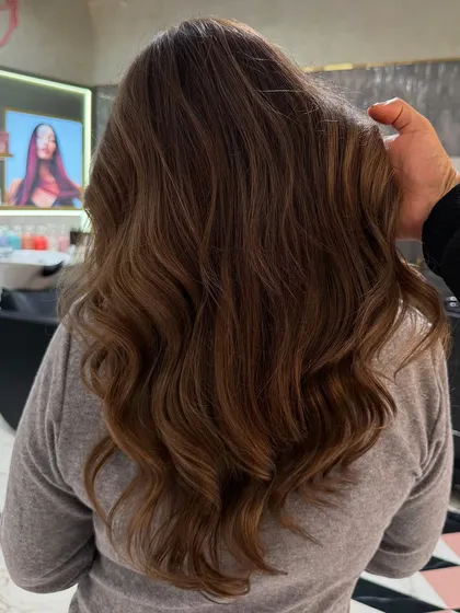 My hand in the shot shows the texture and health of the hair after achieving this stunning ash blonde glow. The hair is soft, shiny, and full of life.