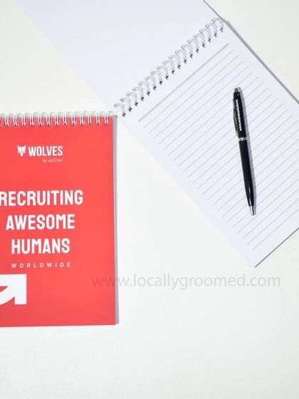 This custom notepad for Wolves features a bold cover that says "Recruiting Awesome Humans Worldwide." It's a great example of how to infuse brand personality into everyday stationery.