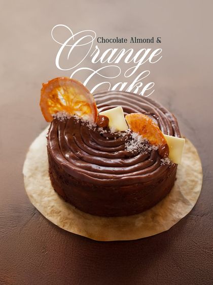 The Chocolate Almond and Orange Cake, a crowd favourite. This image highlights the beautiful swirls of chocolate ganache and the candied orange slice, a hint of the real fruit flavour within.